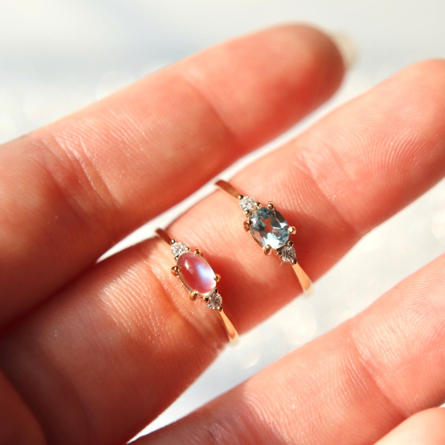 love fest ring, royal moon stone with blue hightlight diamond on each side